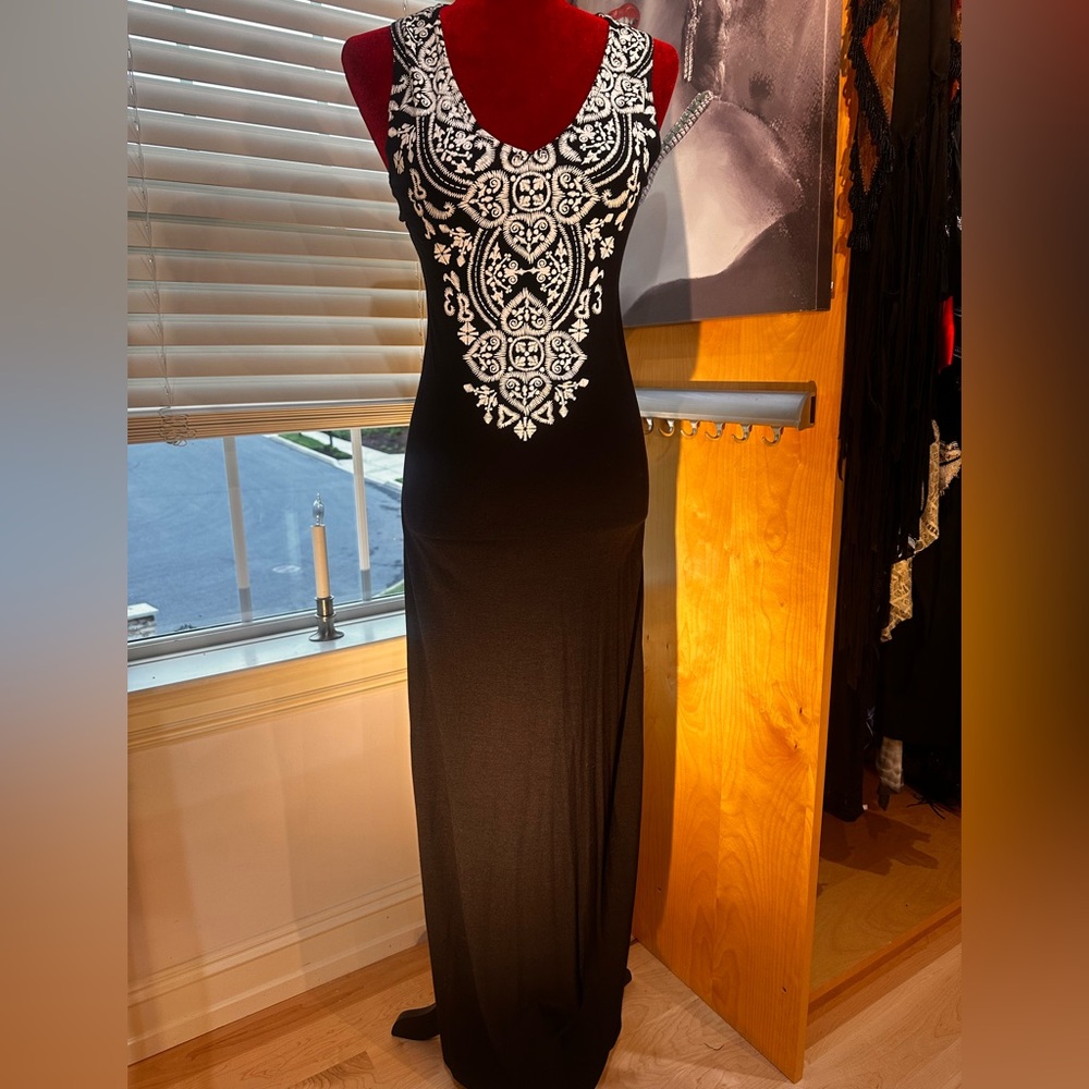 Women’s long summer dress light and airy.  Beautiful white design.
Size S